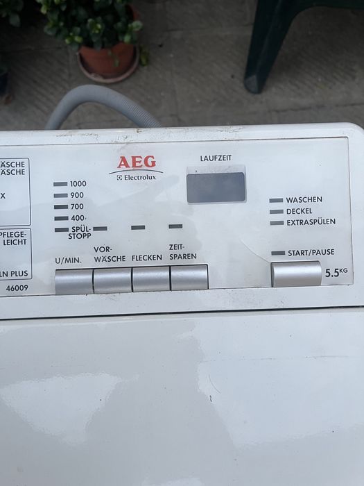 Пералня с горно зареждане AEG