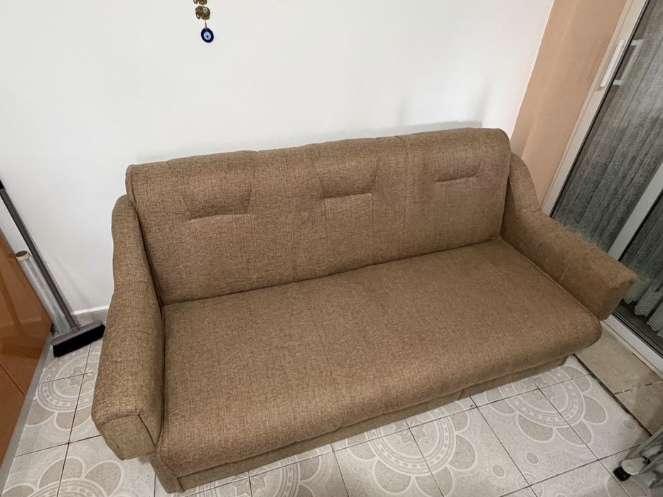 Canapea extensibilă textilă,foarte bine întreținută