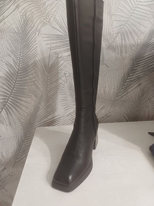 Продам новые сапоги