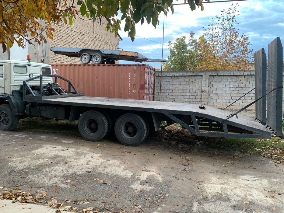 Услуги Эвакуватор перевозка кара экскаватор каток трал  трейлер