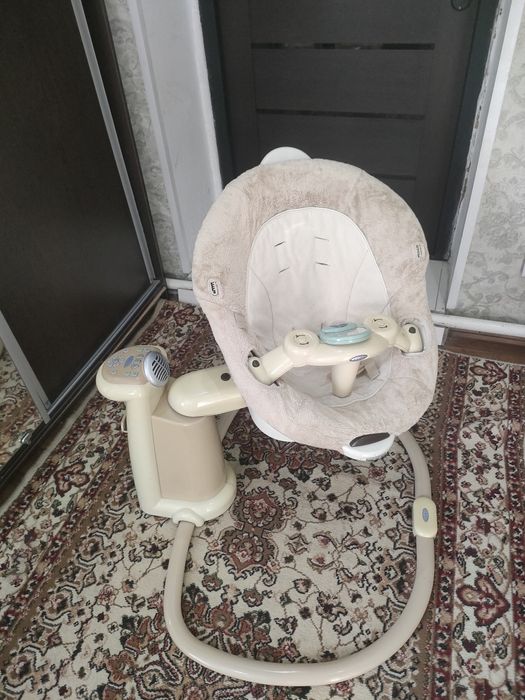 Коляска-качеля для ребенка