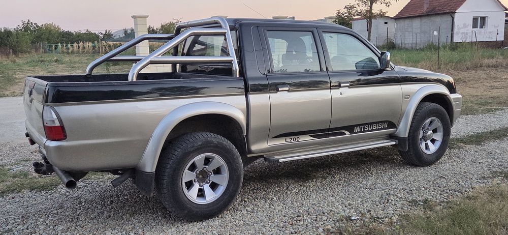 Mitsubishi L 200 climatronic 4x4 cuplaj la mare la mic Diferitial blocabil la buton