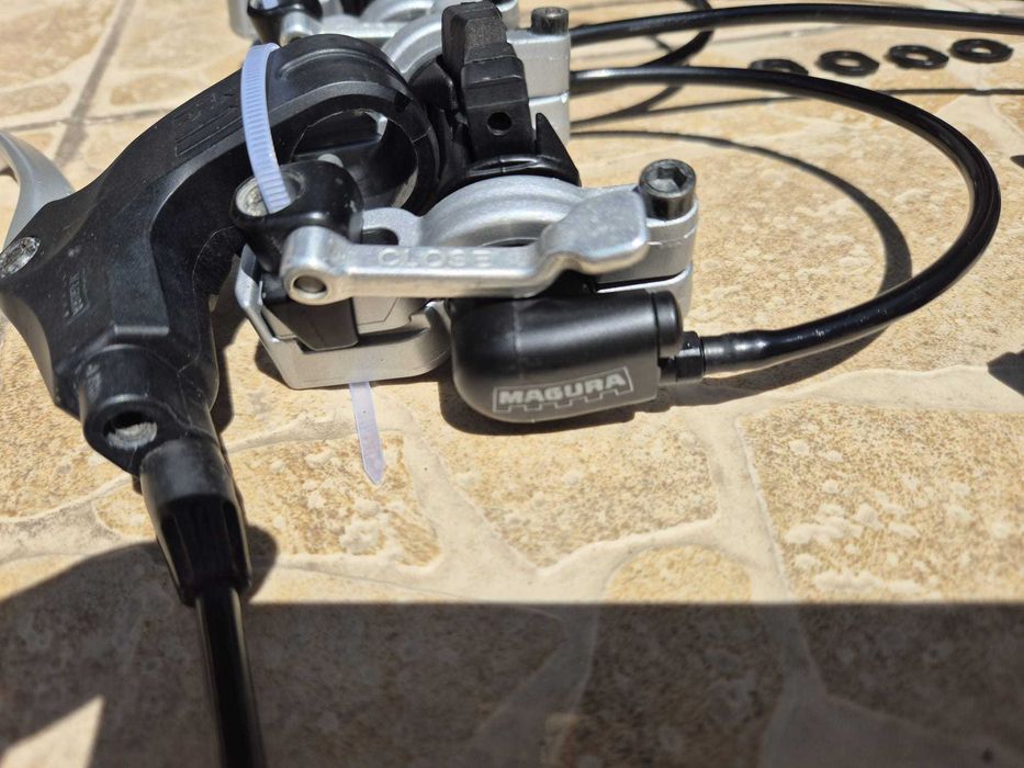Set frane hidraulice Magura HS11-EVO2, inclusiv 2 perechi saboti noi