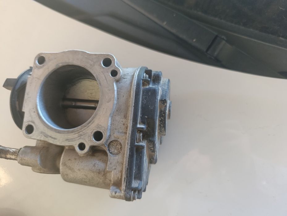 Дроссельная заслонка оргиналь Ласетти 1.6 дан  и́ечилган ҳолати чотки