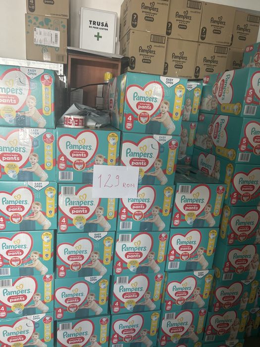 Firma vinde scutece Pampers si Huggies ,produse noi cu factura