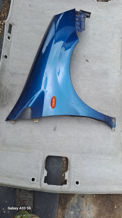 калник Nissan Almera Tino  2000-2006