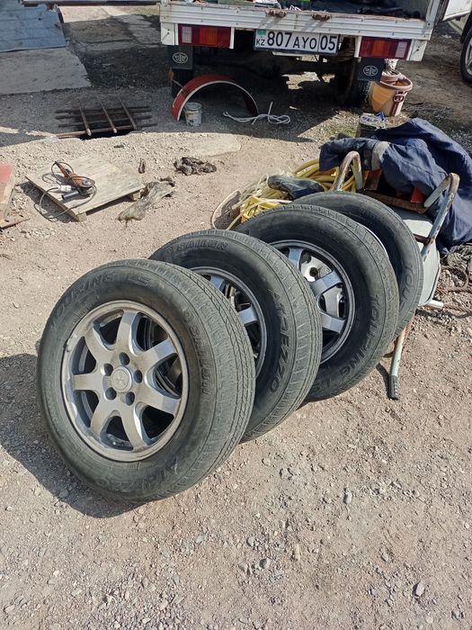 Продам шины с дисками на16/65/215.летные