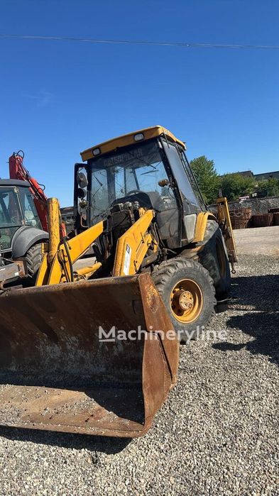 Buldoexcavator Caterpillar 428 C în bucăți