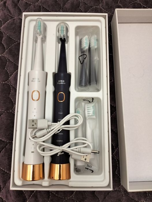 Электрическая зубная щетка