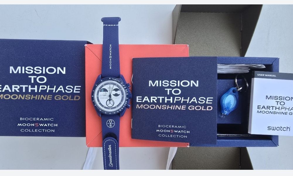 Swatch Omega Mission to Earthpase Moonshine Gold 
Ce
