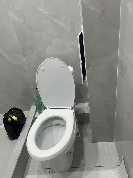 Унитаз с бочком для строительных работ