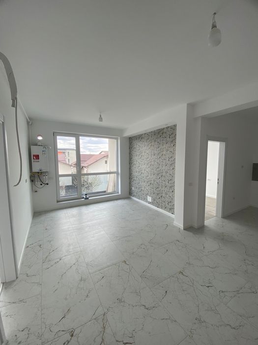 Apartament cu 3 camere+ loc de parcare.