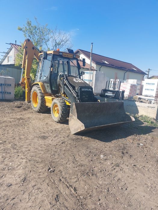 Buldoexcavator Caterpillar
