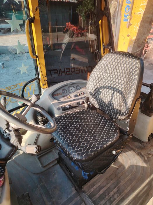 Продавам комбиниран багер