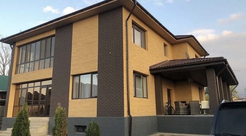 фасадные панели под травертин для вашего дома