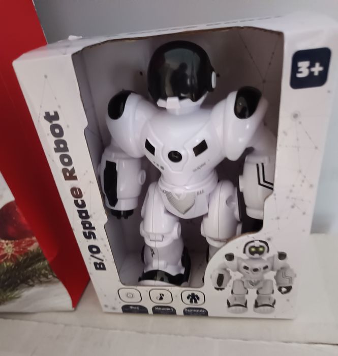 Играчка робот с движеща се музика и светлини, черен/бял

Информация :