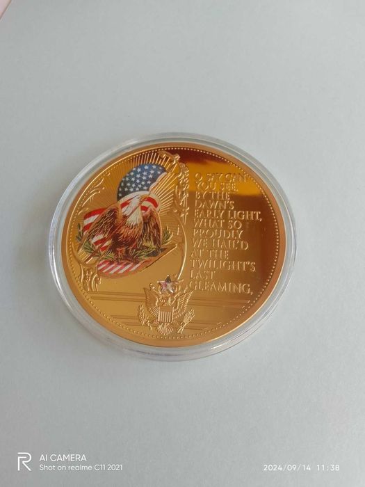 Рядка позлатена възпоменателна монета със звездно знаме