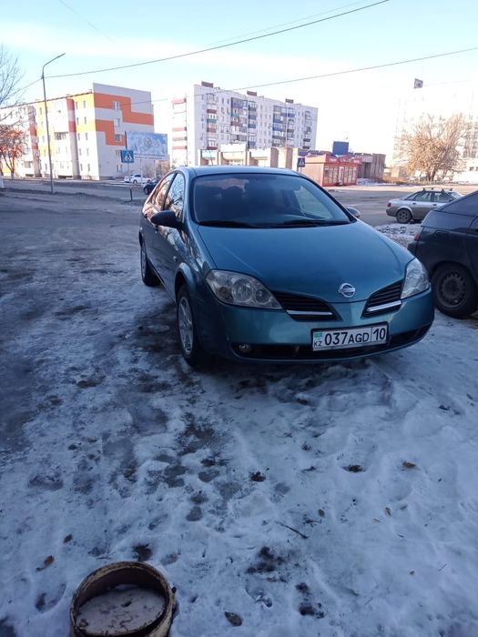 Ниссан п12 2002 год