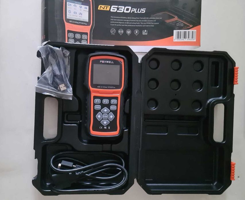 Это автомобильный сканер Foxwell NT630 Plus.
