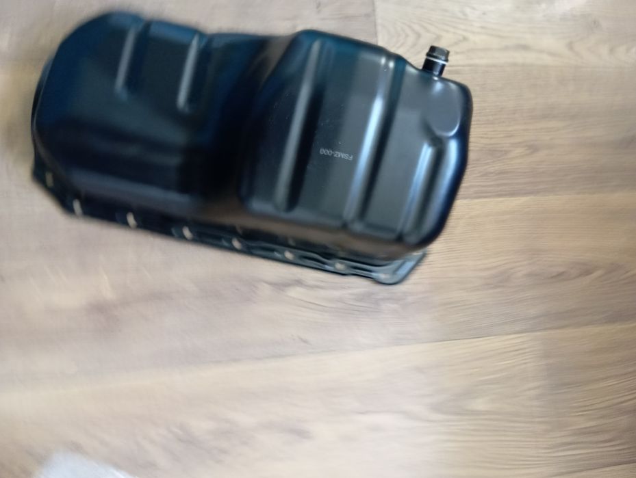 Поддон новый на мазду 323