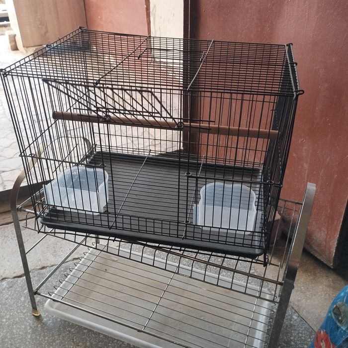 Клетка для попугаев почти новый .