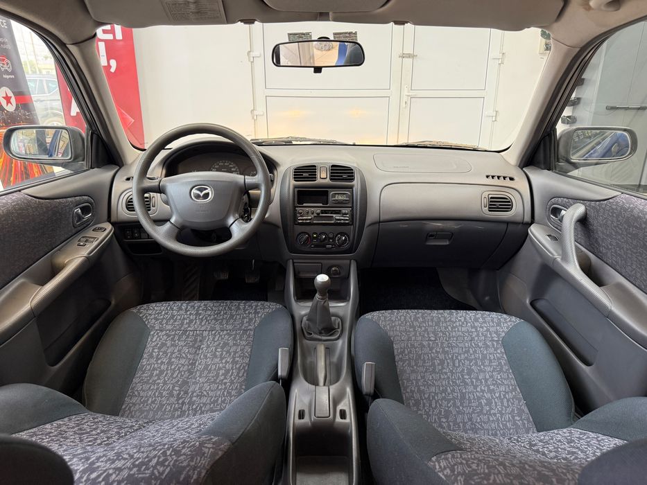 Mazda 323i Sedan 2001 | 1.3i | 90CP | Clima Ac | Radio | 203.000Km