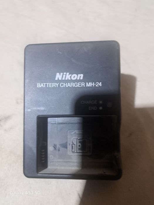 3100 nikon zaryadchik orginal 3ta bor sotiladi 150mingdan