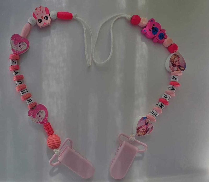 Клипс за биберон и чесалка