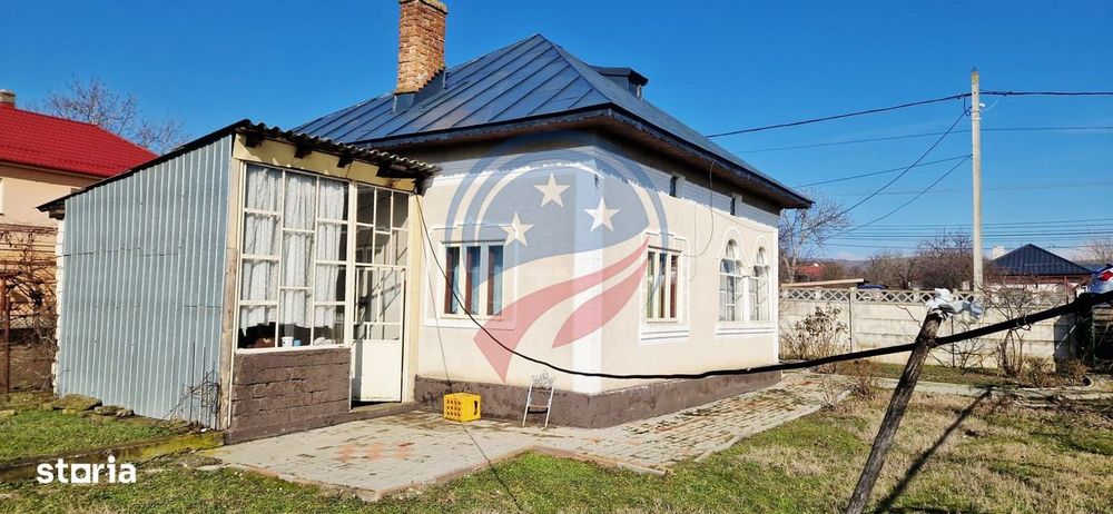 Casa Bradesti  teren  intravilan 7952 mp  deschidere 33 m la DE 70