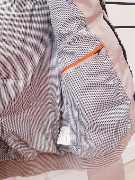 Куртка (пуховик) бежевого цвета от Lawine .