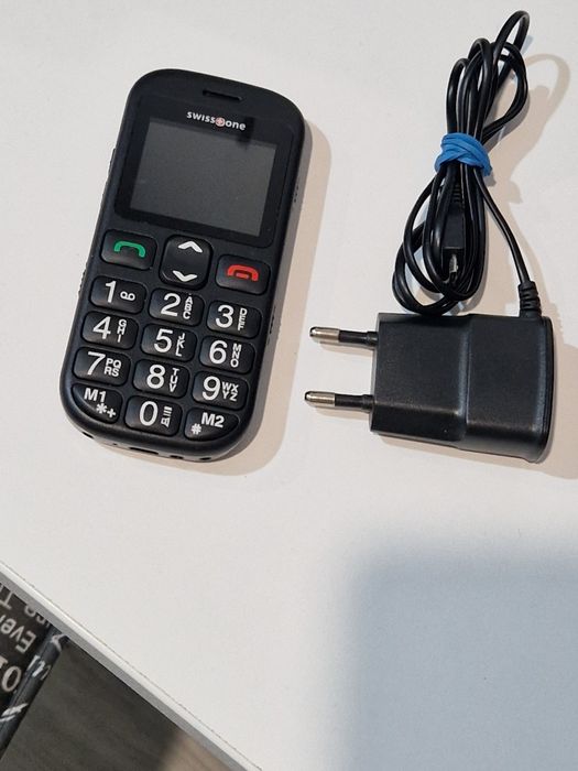 Telefon cu butoane cu încărcător