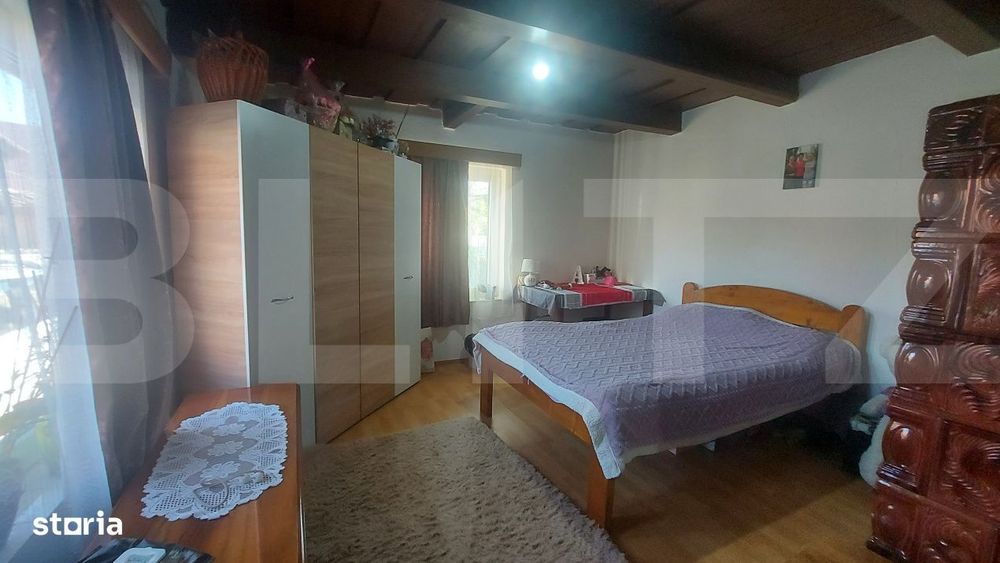 Casa cocheta din lemn masiv cu teren si livada – liniste, natura si