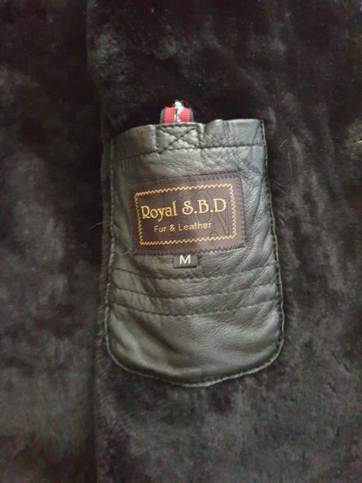 Плащь кожанный с мехом.