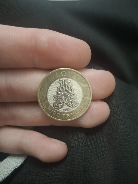 Монета номиналом 100тенге сакский стиль,свернувшиеся олени