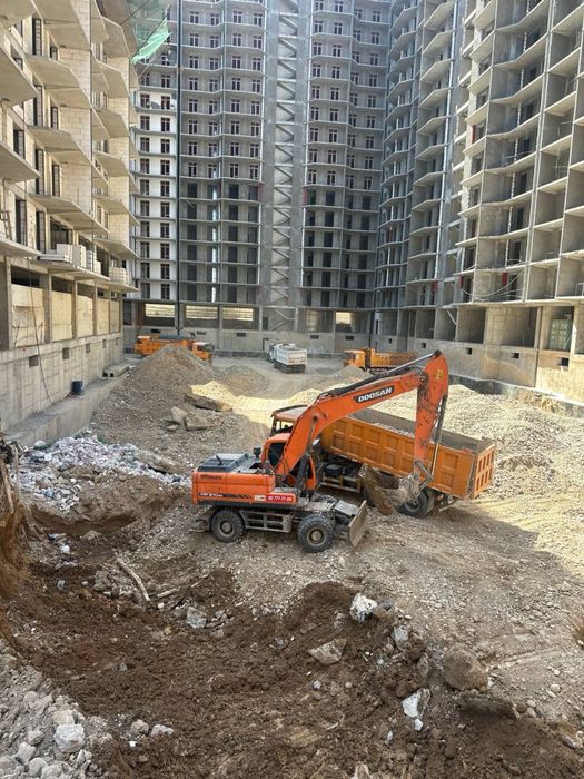 Экскаватор хизмати