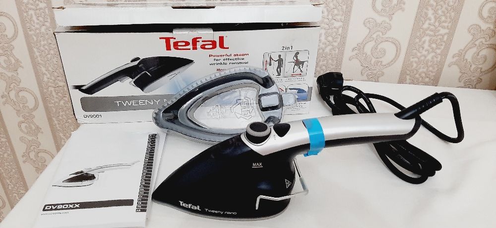 Паровой  утюг  ^