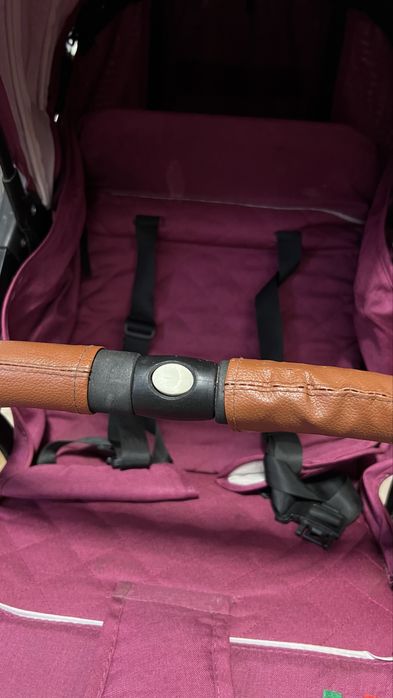 Детская розовая коляска