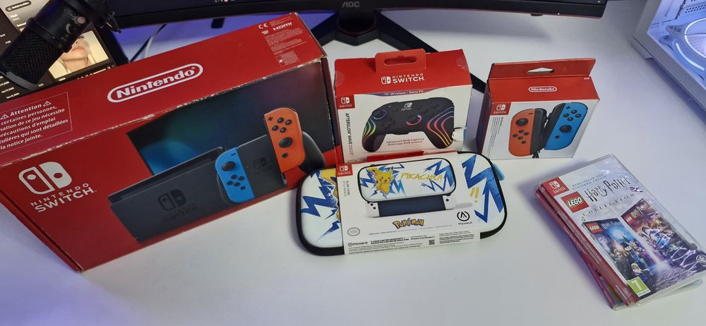Nintendo Switch cu accesorii multe + 4 jocuri
