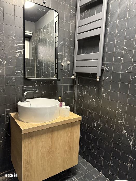 Apartament cu garaj, grădină, aer conditionat și centrală proprie