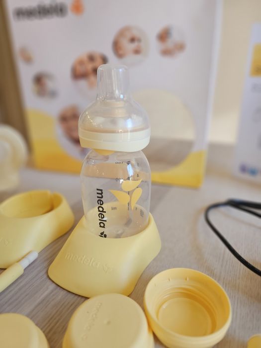 Двойна помпа за кърма Medela Swing Maxi + биберон Calma + подарък