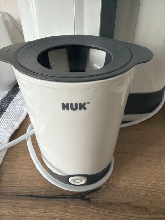 Комплект NUK- стерилизатор и нагревател за шишета.
