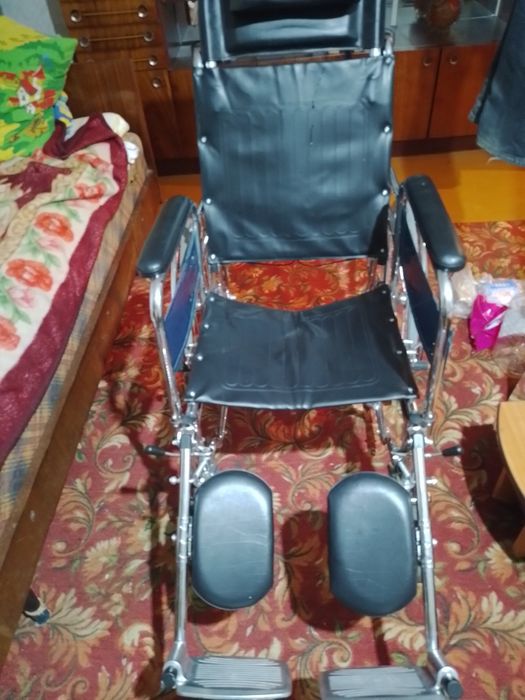 Инвалидная коляска.
