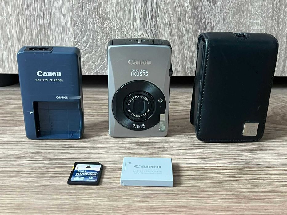 Aparat foto digital camera foto Canon IXUS 75 cu baterie si incarcator originale, card 4gb, poze retro, printeaza data si ora pe foto pt statii itp