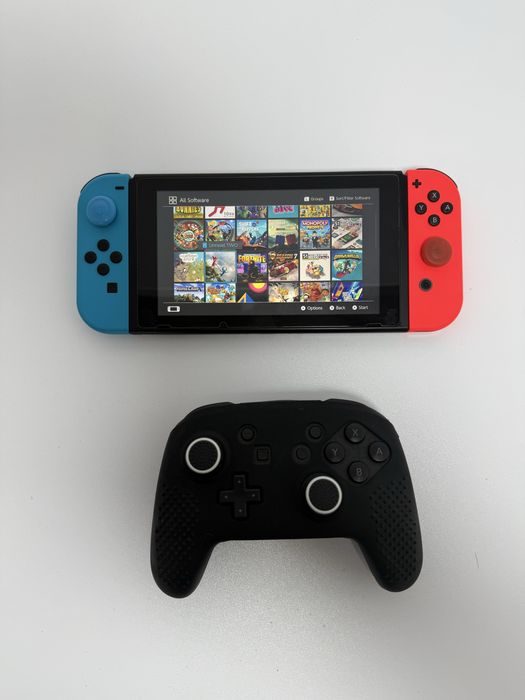 Pachet Nintendo Switch + Ring Fit + Pro Controller + 7 Jocuri (Ca NOU)