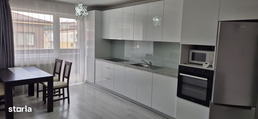 Apartament cu doua dormitoare, parcare proprie, mobilat si utliat — fotografia 1