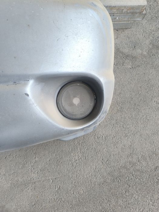 Передний бампер Мазда трибют