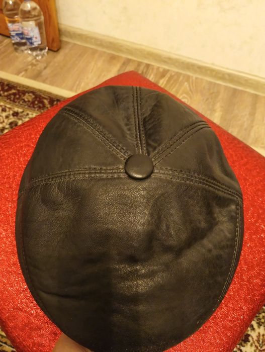 Кожаные шапки с мехом