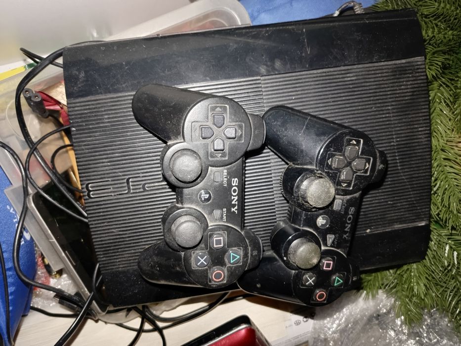 Продам PlayStation 3,руль ,и диски.