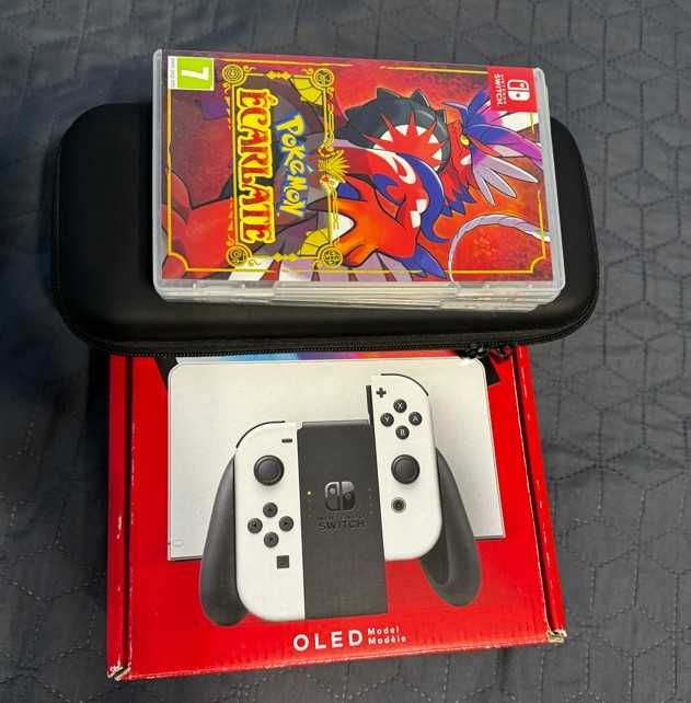 Nintendo Switch OLED + 3 jocuri Pokemon + folie + carcasa – stare foarte buna