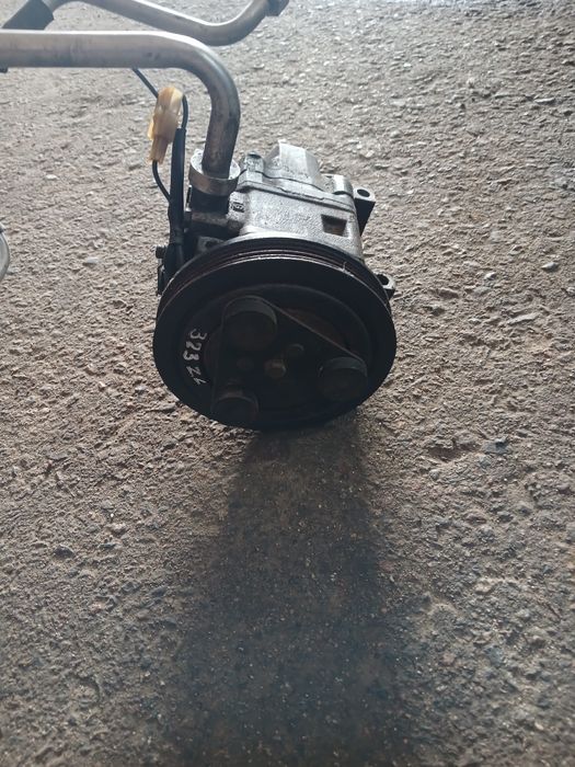 Компрессор кондиционера Мазда 323